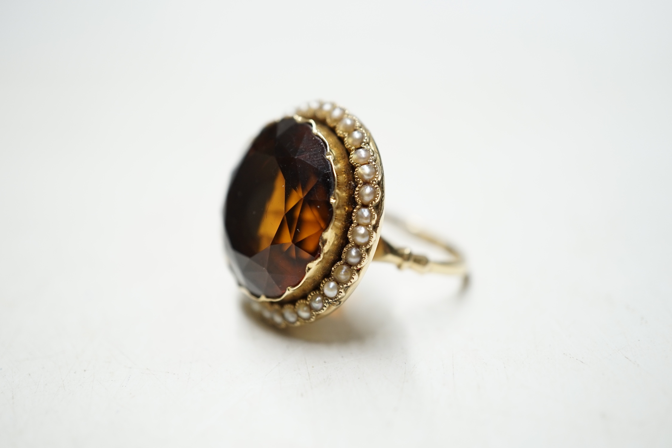 A yellow metal, citrine and seed pearl cluster set circular dress ring, size L, gross weight 10.8 grams. Condition - fair